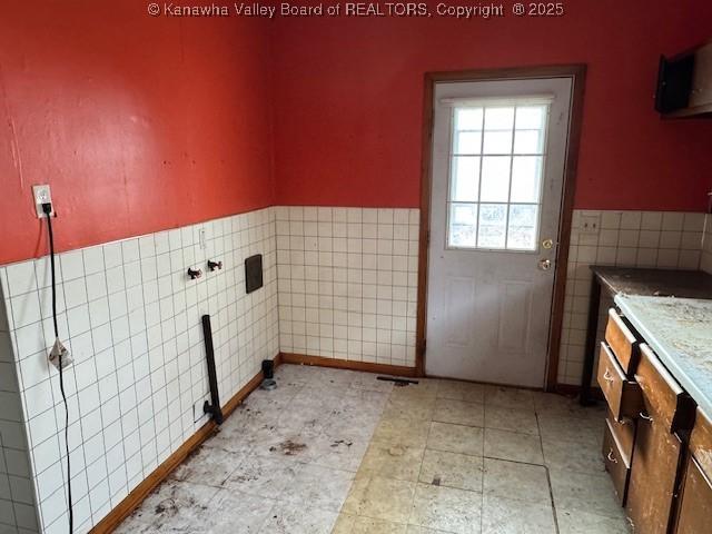 311 1/2 Westmoreland Dr, Charleston, WV 25302 - washroom featuring tile walls and wainscoting