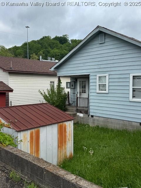 311 1/2 Westmoreland Dr, Charleston, WV 25302 - rear view of property featuring a shed and an outbuilding