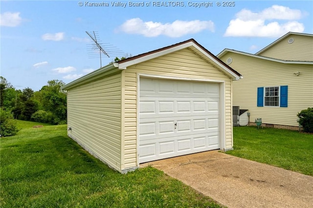 detached garage featuring driveway