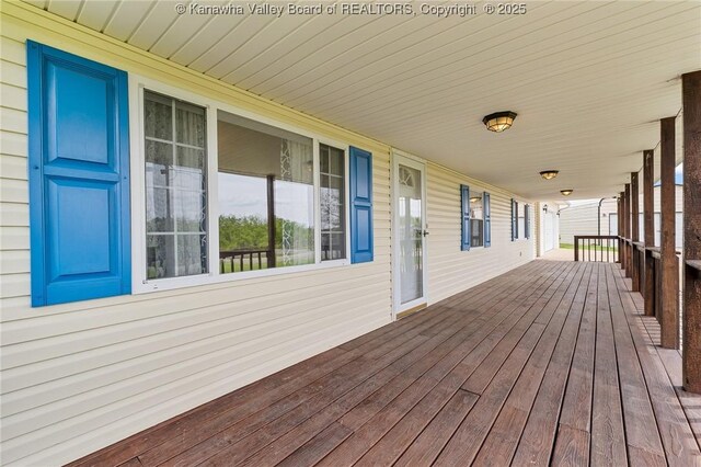wooden terrace with a porch