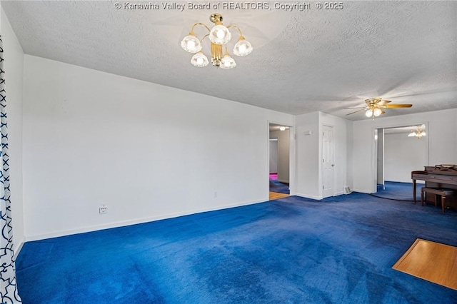 unfurnished living room featuring a chandelier, a textured ceiling, carpet floors, baseboards, and ceiling fan