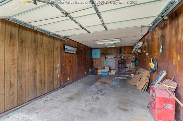 garage featuring wood walls