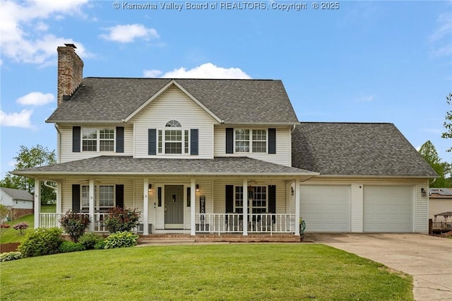 colonial house with a garage, concrete driveway, covered porch, a chimney, and a front yard