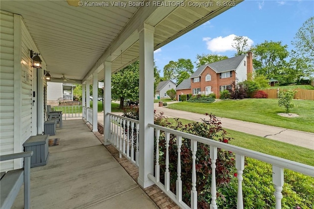 view of patio featuring covered porch and a residential view