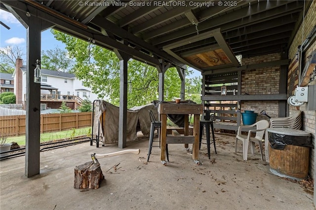view of patio featuring fence