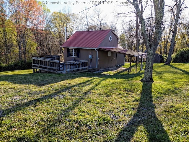 6531 Lockbridge Rd, Wv, WV 25976 - rear view of house featuring metal roof, a lawn, and a deck