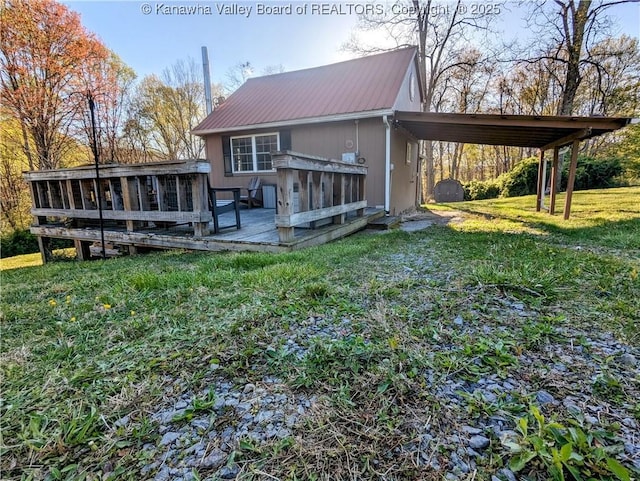 6531 Lockbridge Rd, Wv, WV 25976 - rear view of house featuring metal roof, a wooden deck, a lawn, and a carport