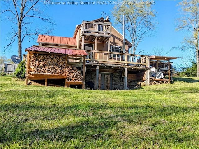 6531 Lockbridge Rd, Wv, WV 25976 - rear view of house with stone siding, a wooden deck, metal roof, and a lawn