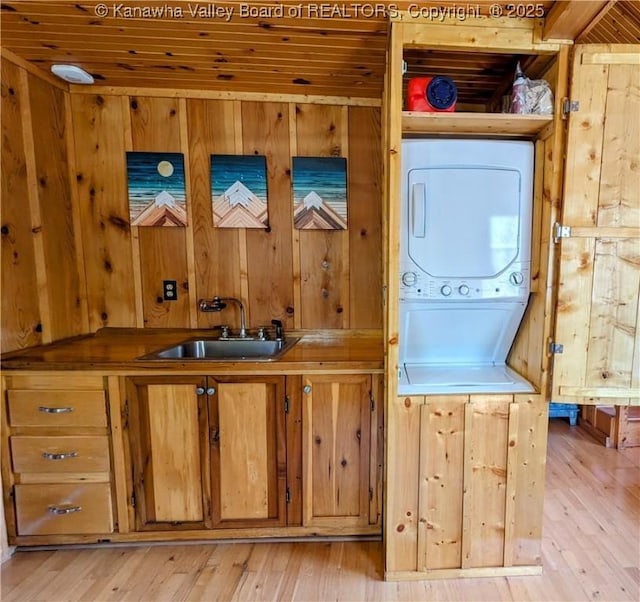 6531 Lockbridge Rd, Wv, WV 25976 - clothes washing area with stacked washer / dryer, wood walls, light wood-style flooring, and wood ceiling