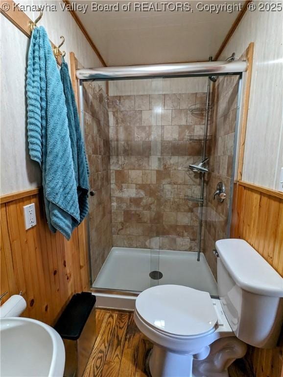 6531 Lockbridge Rd, Wv, WV 25976 - bathroom featuring a shower stall, toilet, wooden walls, a wainscoted wall, and ornamental molding