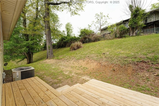 wooden terrace featuring central AC unit