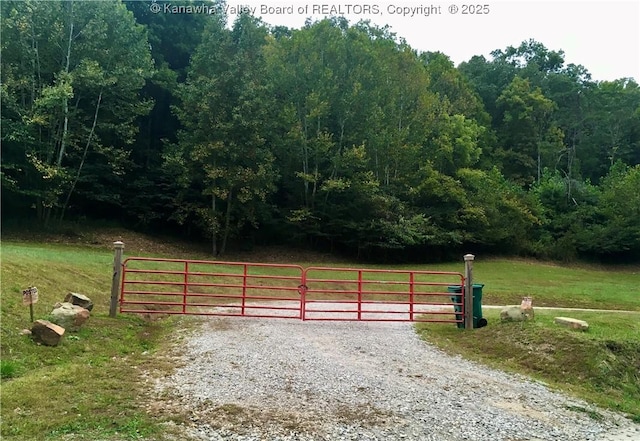 728 Honeycutt Rd, Fraziers Bottom, WV 25082 - gate featuring a view of trees and a yard