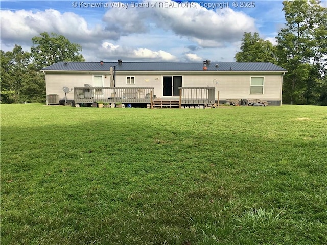 728 Honeycutt Rd, Fraziers Bottom, WV 25082 - rear view of house with a yard, a wooden deck, cooling unit, and metal roof
