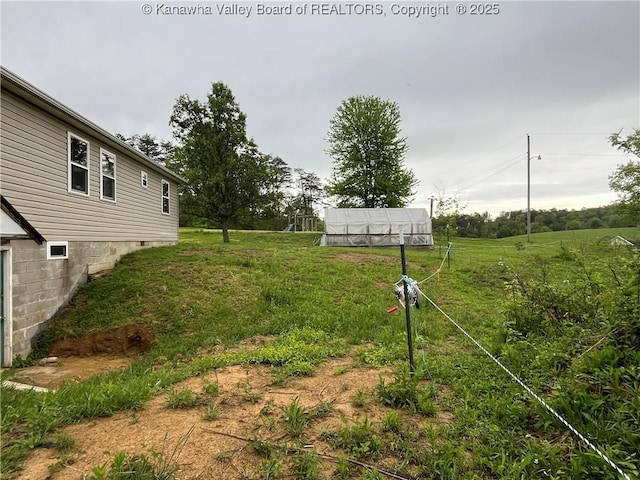 5860 Union Campground Rd, Letart, WV 25253 - view of yard featuring a greenhouse and an outbuilding