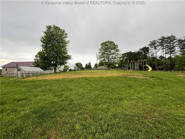 5860 Union Campground Rd, Letart, WV 25253 - view of green lawn with a greenhouse and an outbuilding