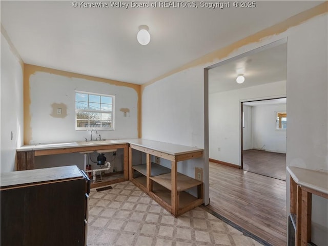 1302 Adele St, Charleston, WV 25302 - office area featuring plenty of natural light, light wood-type flooring, and a sink