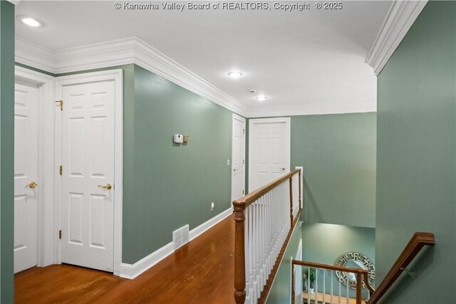12 W Coventry Rd, South Charleston, WV 25309 - corridor with an upstairs landing, crown molding, wood finished floors, baseboards, and recessed lighting