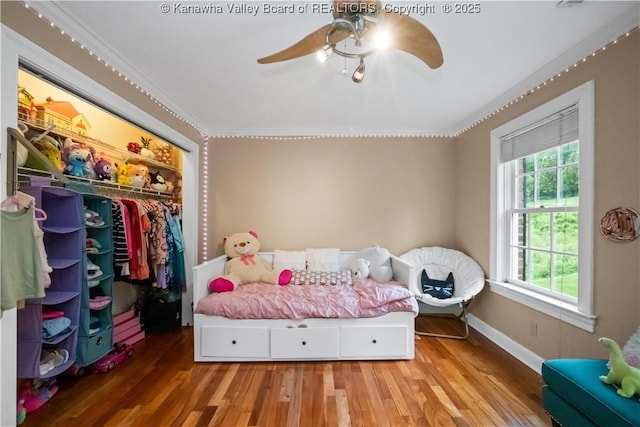 12 W Coventry Rd, South Charleston, WV 25309 - bedroom featuring wood finished floors, a closet, ornamental molding, baseboards, and a ceiling fan