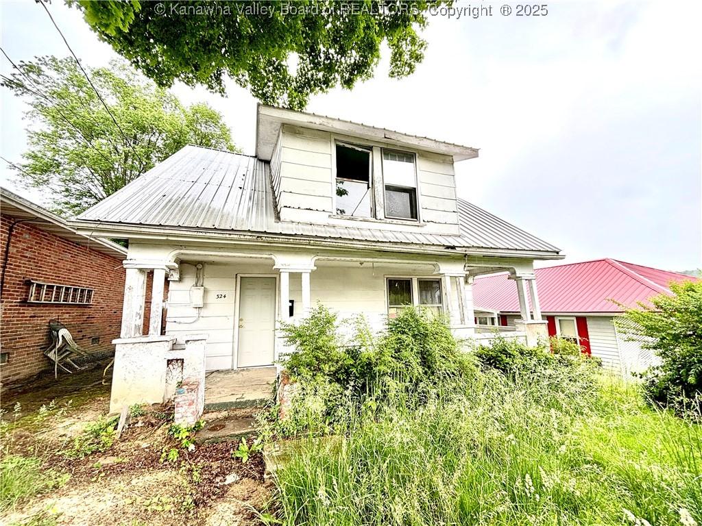 324 High School Ave, Hurricane, WV 25526 - bungalow featuring covered porch and metal roof