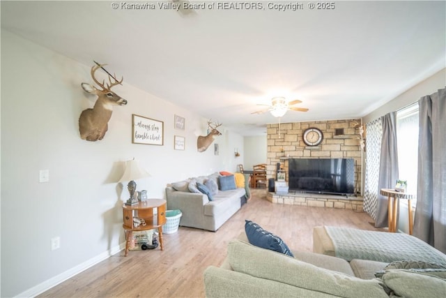 2611 Larwood Dr, Charleston, WV 25302 - living area with ceiling fan, a fireplace, wood finished floors, and baseboards