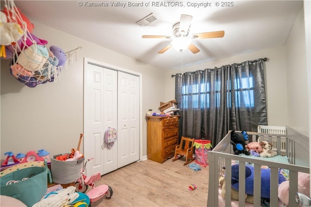 2611 Larwood Dr, Charleston, WV 25302 - bedroom with wood finished floors, a closet, and ceiling fan