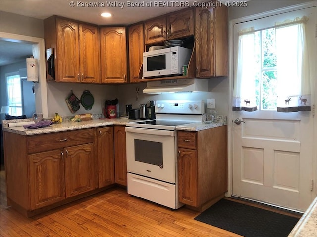 329 3rd Ave, Ripley, WV 25271 - kitchen with white appliances, brown cabinets, under cabinet range hood, light wood finished floors, and recessed lighting