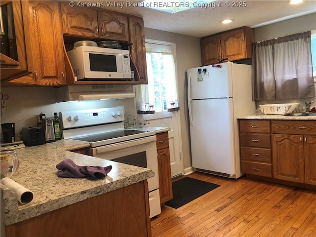 329 3rd Ave, Ripley, WV 25271 - kitchen featuring white appliances, light wood-style flooring, brown cabinetry, and recessed lighting
