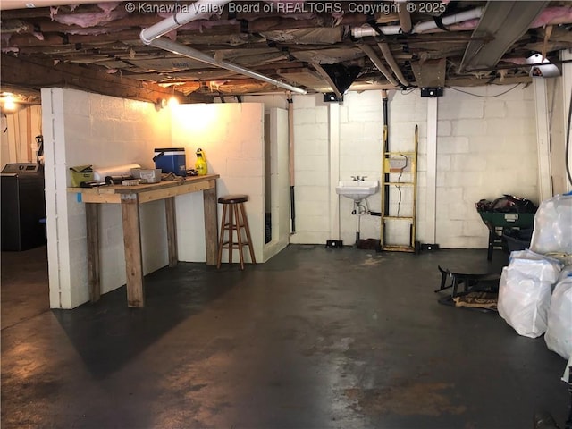 329 3rd Ave, Ripley, WV 25271 - unfinished below grade area with washer / clothes dryer, a sink, and concrete block wall
