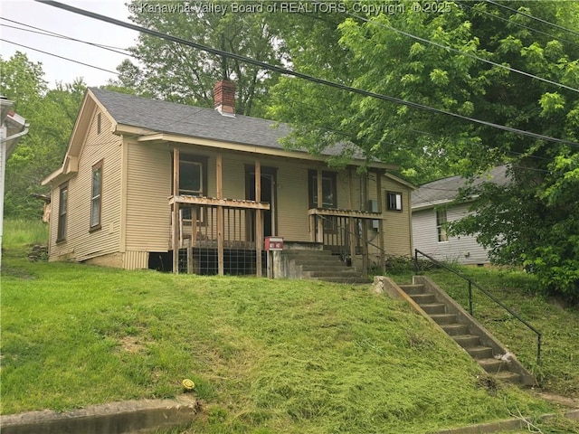 1620 Red Oak St, Charleston, WV 25387 - back of house with a chimney, a porch, a yard, and roof with shingles