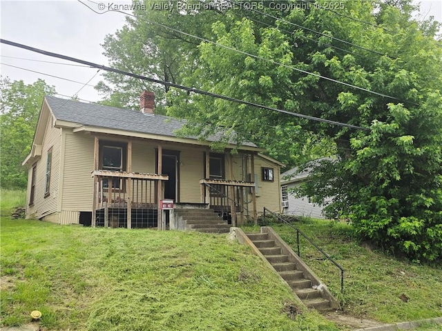 1620 Red Oak St, Charleston, WV 25387 - view of front of property with covered porch, a chimney, stairs, a shingled roof, and a front yard
