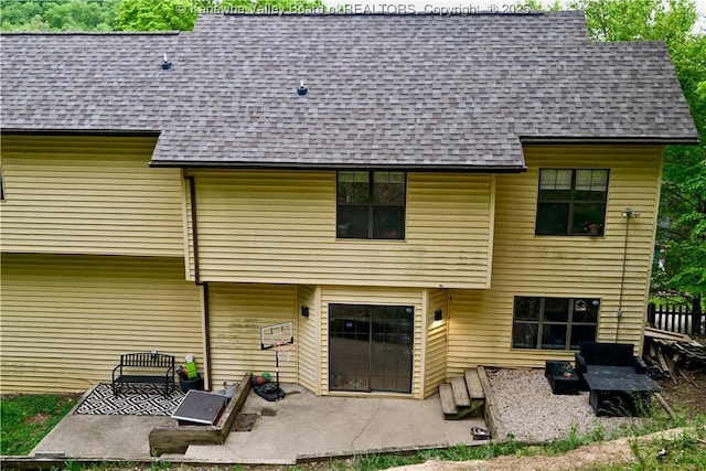5427 Hillbrook Dr, Charleston, WV 25313 - back of house featuring a shingled roof and a patio area