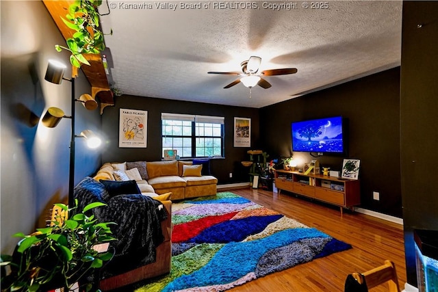 5427 Hillbrook Dr, Charleston, WV 25313 - home theater featuring a ceiling fan, wood finished floors, baseboards, and a textured ceiling