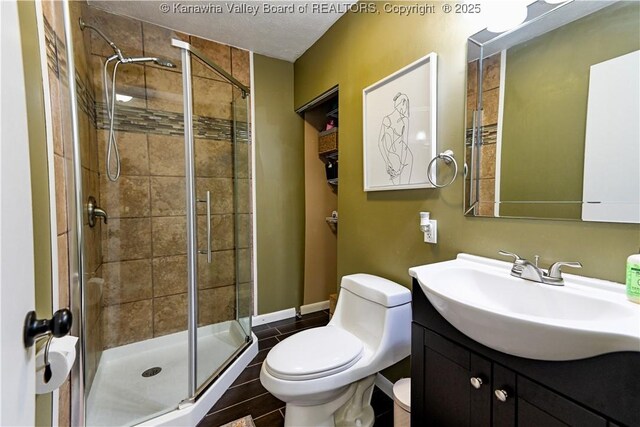 5427 Hillbrook Dr, Charleston, WV 25313 - full bath featuring a stall shower, toilet, vanity, and baseboards