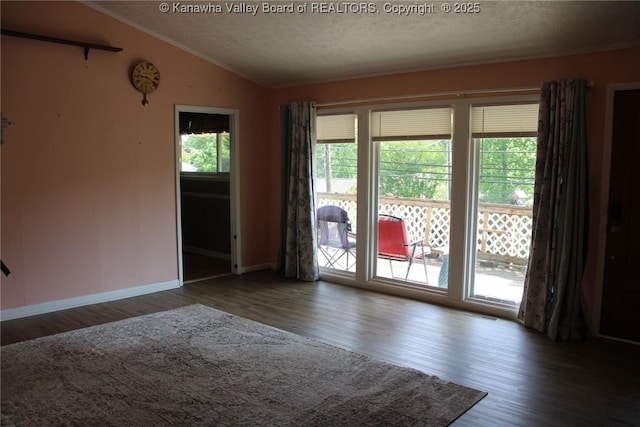 1741 Huber Rd, Charleston, WV 25314 - empty room with vaulted ceiling, wood finished floors, a textured ceiling, baseboards, and ornamental molding