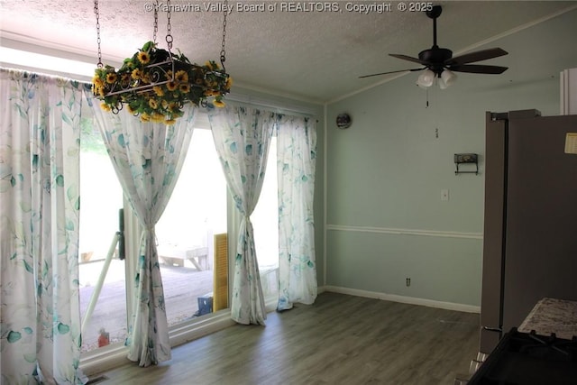 1741 Huber Rd, Charleston, WV 25314 - unfurnished dining area featuring ceiling fan, crown molding, wood finished floors, a textured ceiling, and baseboards