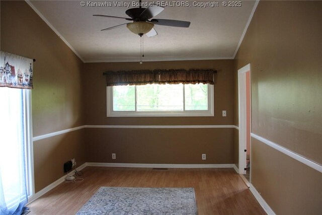 1741 Huber Rd, Charleston, WV 25314 - empty room with wood finished floors, ornamental molding, ceiling fan, and baseboards