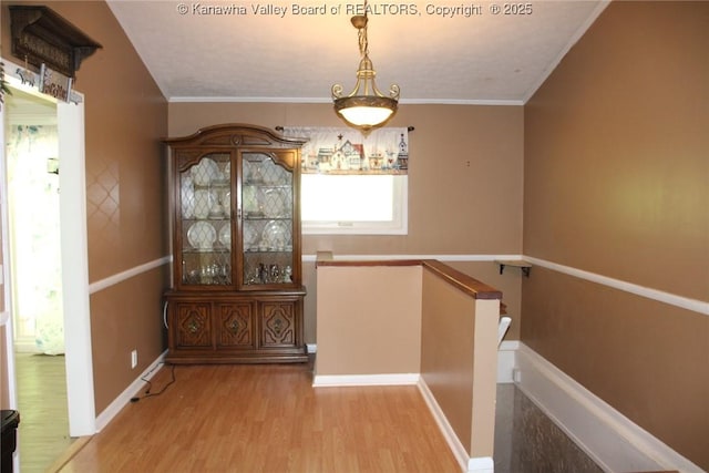 1741 Huber Rd, Charleston, WV 25314 - hall with wood finished floors, an upstairs landing, baseboards, and crown molding