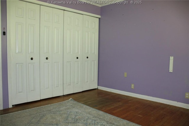 1741 Huber Rd, Charleston, WV 25314 - unfurnished bedroom with baseboards, wood finished floors, and a closet