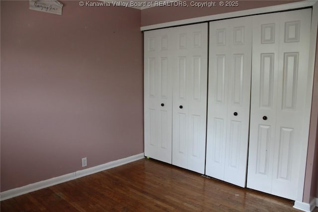 1741 Huber Rd, Charleston, WV 25314 - unfurnished bedroom featuring a closet, baseboards, and wood finished floors