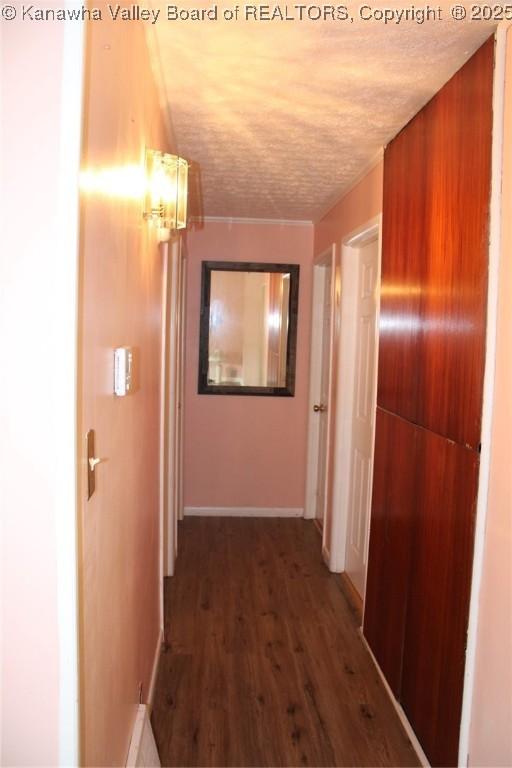 1741 Huber Rd, Charleston, WV 25314 - hall with a textured ceiling, wood finished floors, and baseboards