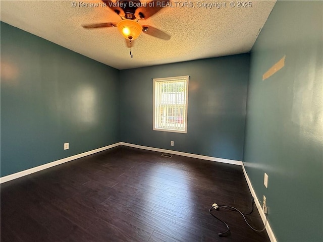 1886 Whitman Creek Rd, Whitman, WV 25652 - spare room with a textured ceiling, a ceiling fan, baseboards, and dark wood-style floors