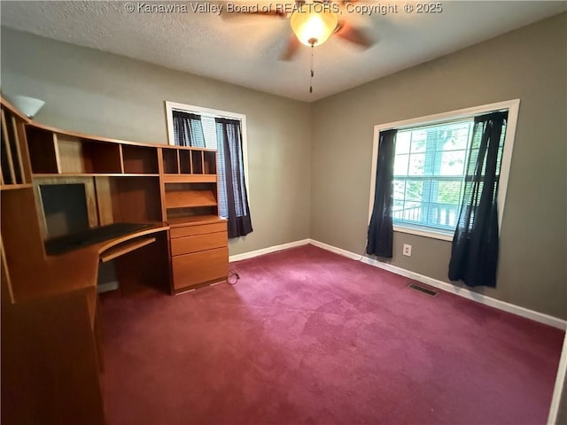 1886 Whitman Creek Rd, Whitman, WV 25652 - unfurnished office featuring dark colored carpet, baseboards, and ceiling fan