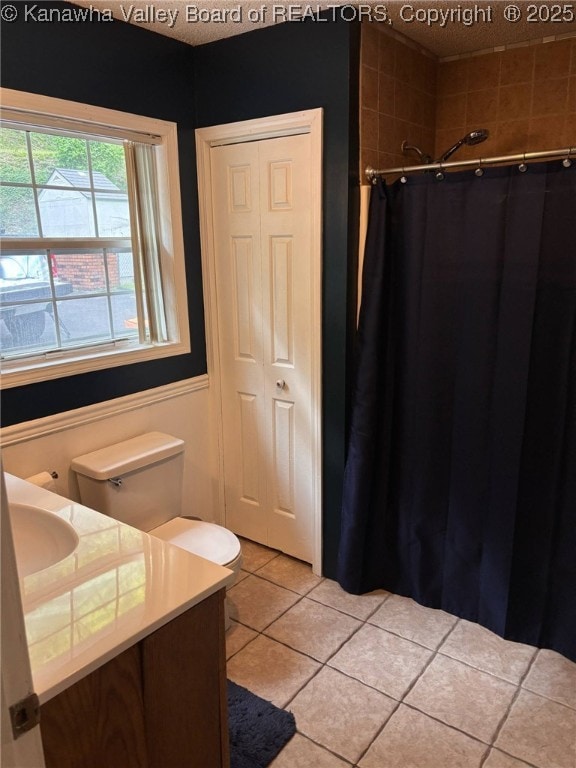 1886 Whitman Creek Rd, Whitman, WV 25652 - full bathroom with tile patterned floors, vanity, a shower with shower curtain, and a wainscoted wall