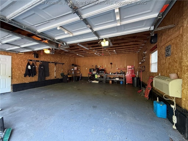 1886 Whitman Creek Rd, Whitman, WV 25652 - garage featuring a garage door opener and a workshop area