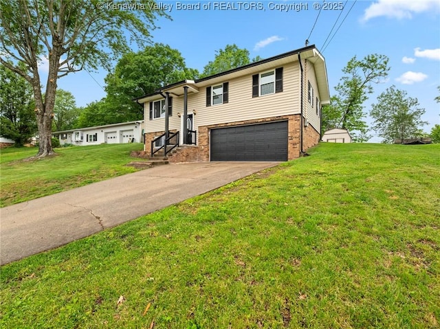 bi-level home featuring a garage, brick siding, concrete driveway, and a front yard
