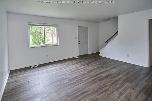 4707 A Marklana Ln, South Charleston, WV 25309 - unfurnished living room with dark wood-type flooring and baseboards