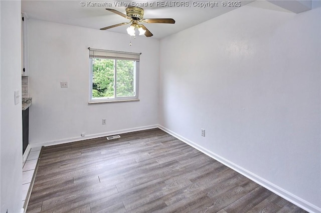 4707 A Marklana Ln, South Charleston, WV 25309 - spare room with ceiling fan, wood finished floors, and baseboards