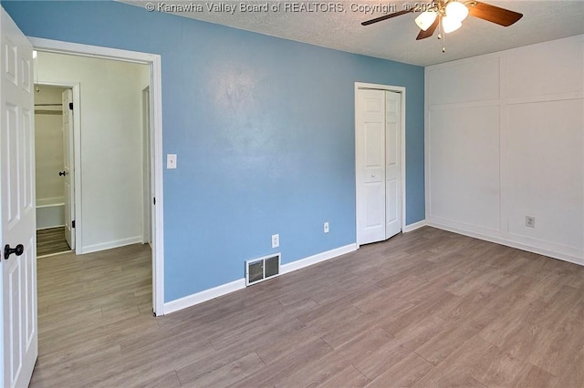 4707 A Marklana Ln, South Charleston, WV 25309 - empty room with a ceiling fan, wood finished floors, baseboards, and a textured ceiling