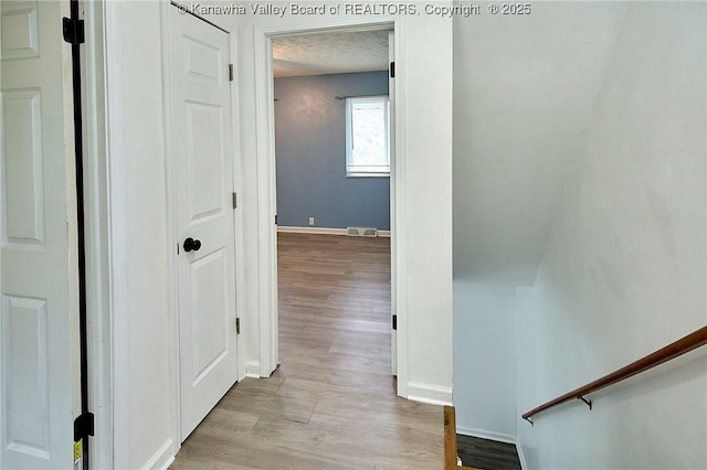 4707 A Marklana Ln, South Charleston, WV 25309 - hallway with light wood-style flooring and baseboards
