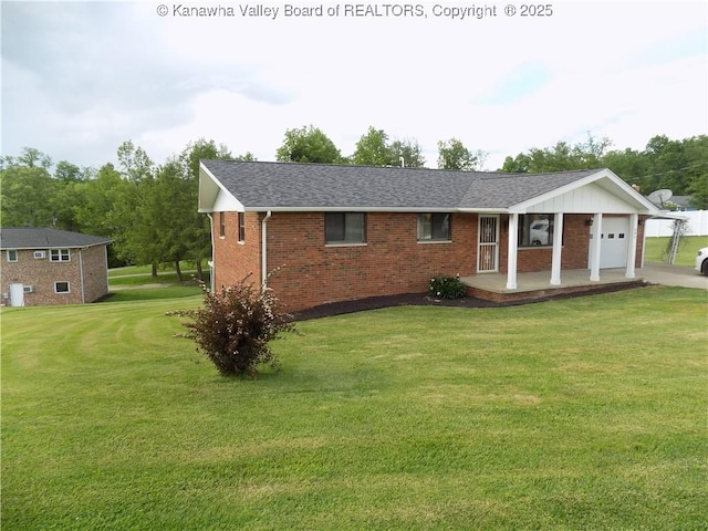 101 Ebony Dr, Cross Lanes, WV 25313 - ranch-style home with a garage, a front yard, brick siding, and a shingled roof